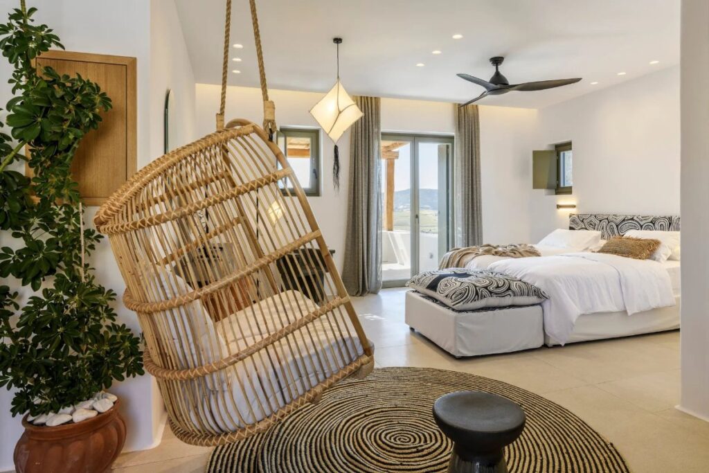 Comfortable bedroom, boho style, and a swing in the top rental villa, Mykonos.