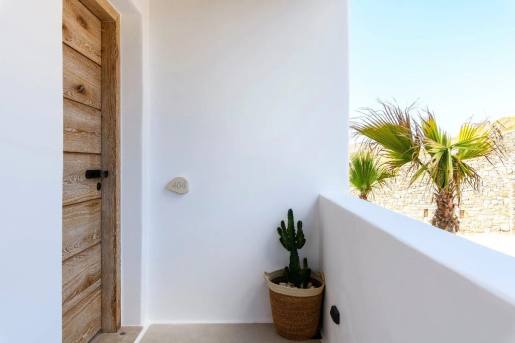 Cactus and palm at the entrance of a lavish villa for rent, Mykonos.