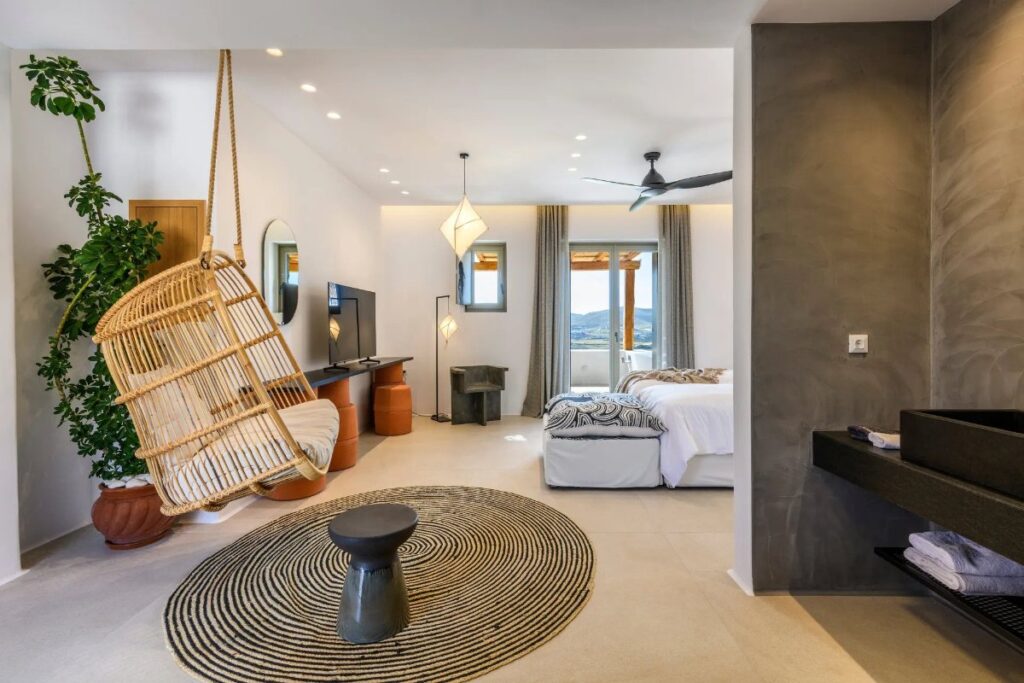 Super modern bedroom with a swing and bathroom in a luxurious villa for rent, Mykonos.