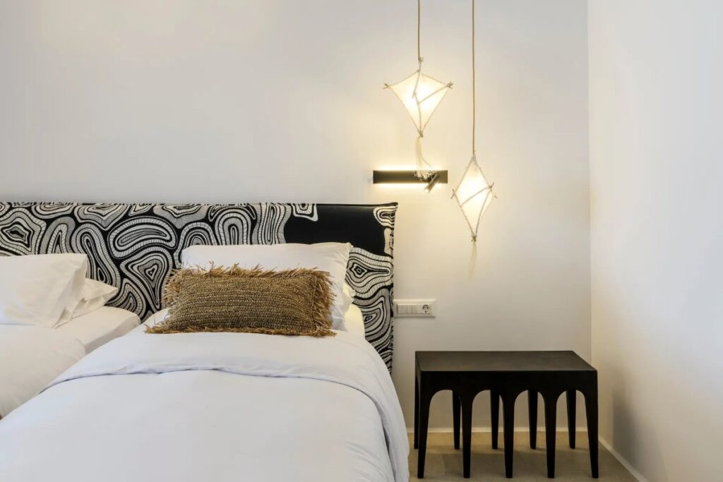 Soft lights and a spacious bedroom in the finest rental villa in Mykonos.