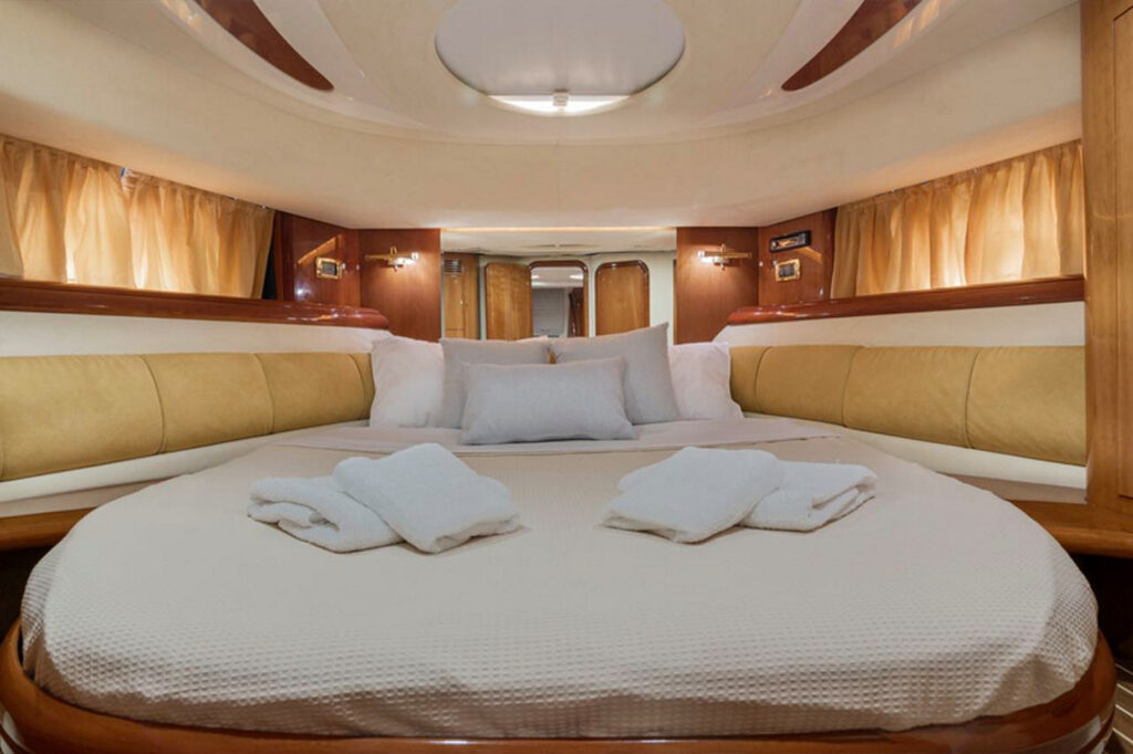 Modern interior and a comfy bed in the best yacht in Mykonos, Greece.