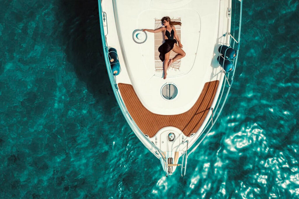 Enjoy sunbathing on the best yacht for rent, in Mykonos.