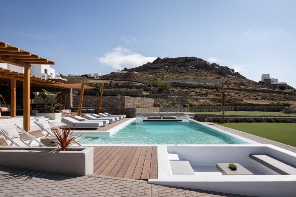 Relax by the poolside at our idyllic rental villa in Mykonos.