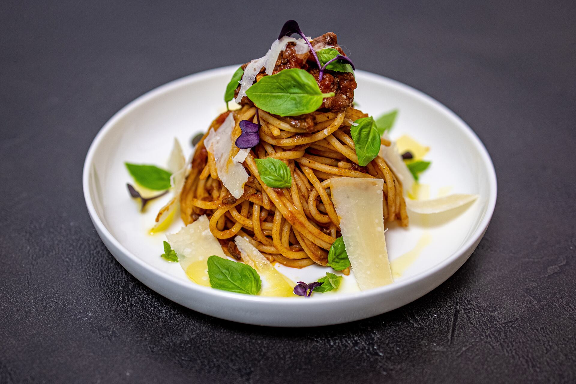 A white plate topped with pasta