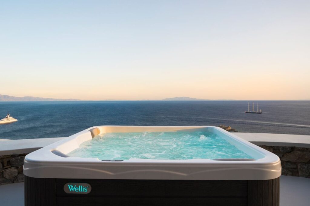 Jacuzzi and the view of the Aegean Sea, Mykonos lavish villa for rent.