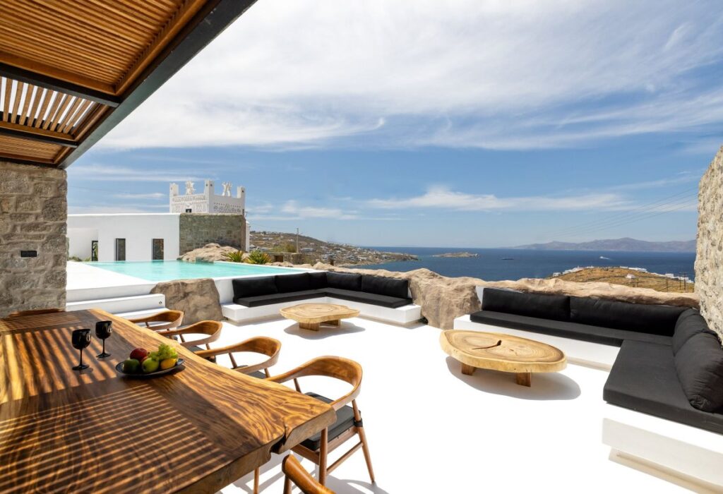 Breath-taking view of the Aegean Sea and a spacious terrace in Mykonos finest villa for rent.