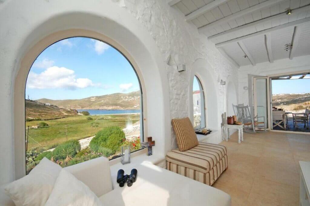 Living room with an amazing view and a terrace in top rental villa, Mykonos