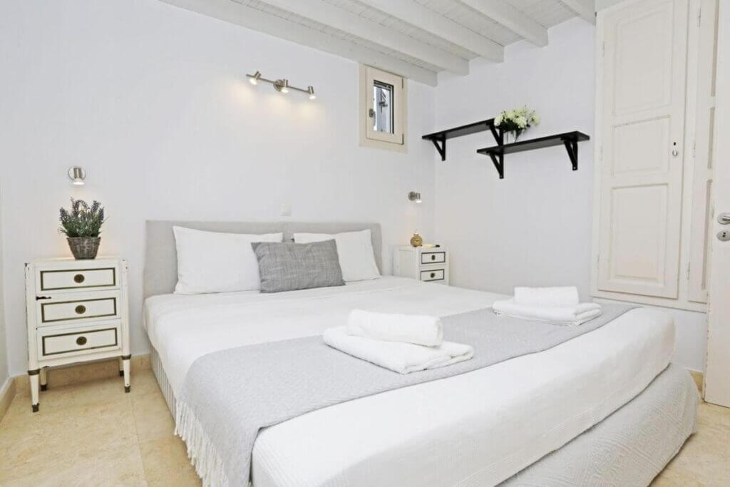 Lavish bedroom in a top-tier Mykonos vacation villa.