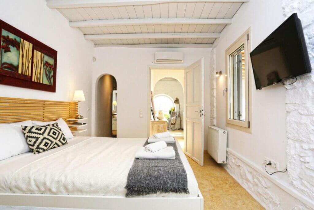 Luxurious bedroom in Mykonos exceptional villa for booking.