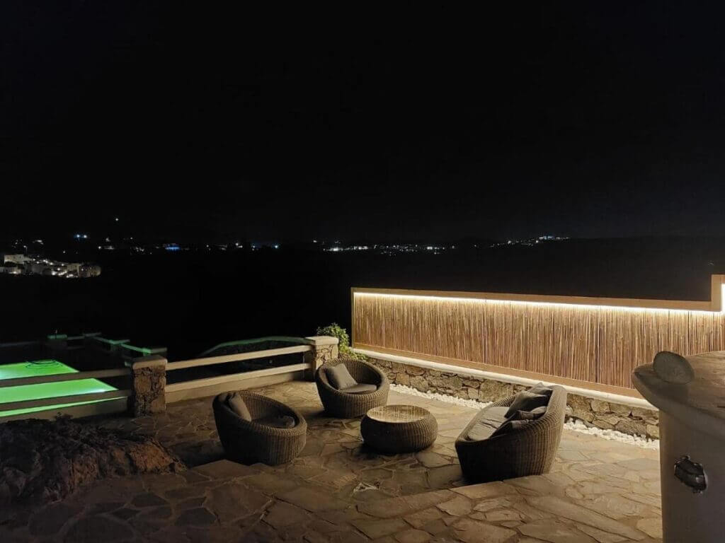 The view of Mykonos by night from our lavish villa for rent.