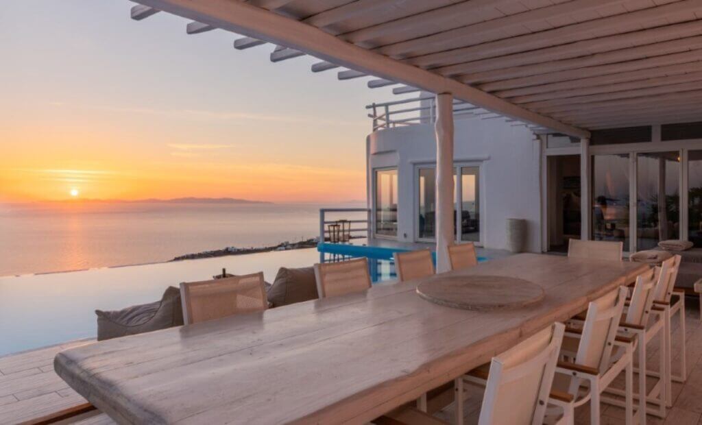 Enjoy the magical sunset and vibrant atmosphere in Mykonos best villa's terrace.