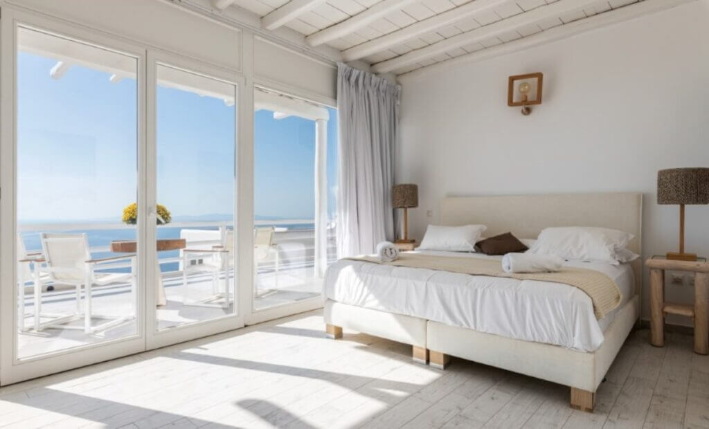 Stylish bedroom in Mykonos' premier villa available for booking.