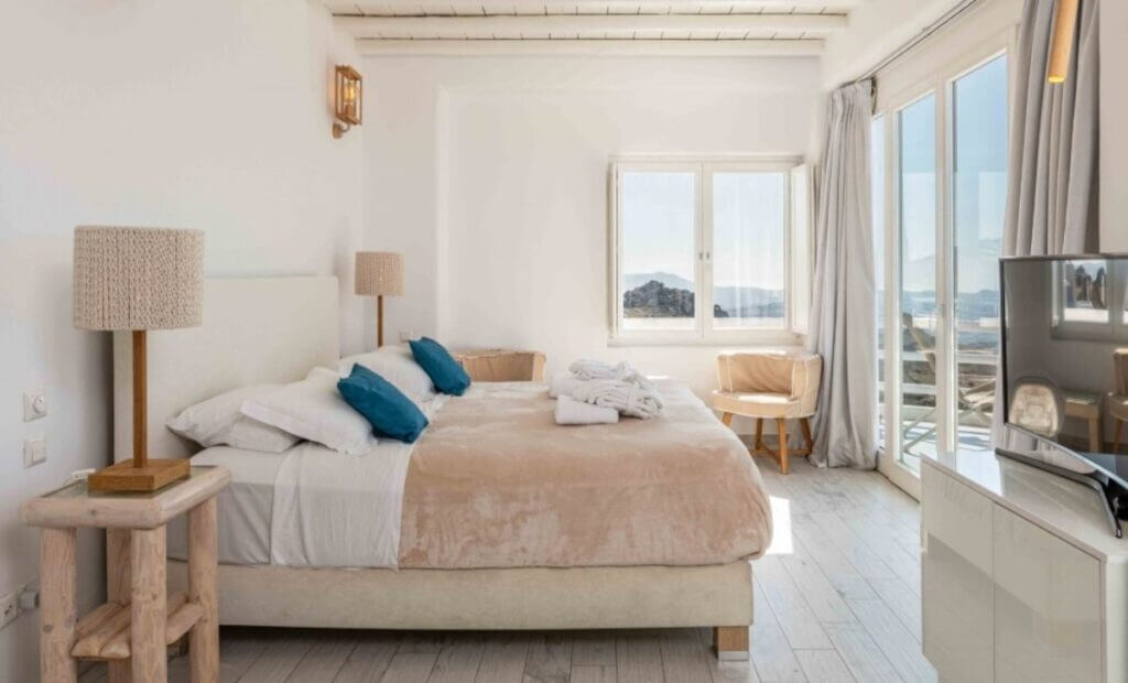 Serene bedroom in a top-tier villa rental in Mykonos.