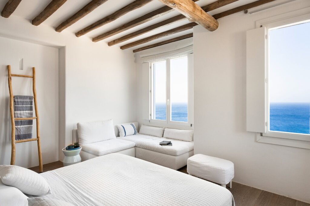 Bedroom with stunning view in Mykonos villa.