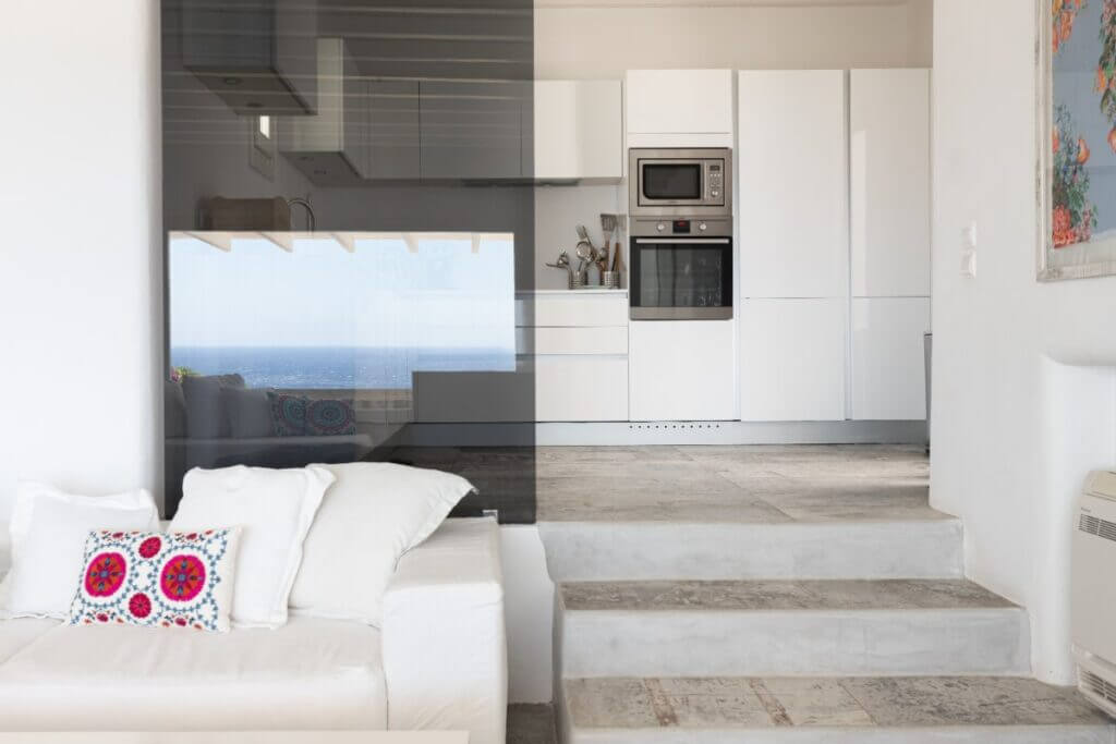 Living room and kitchen in Mykonos deluxe rental villa, Greece.
