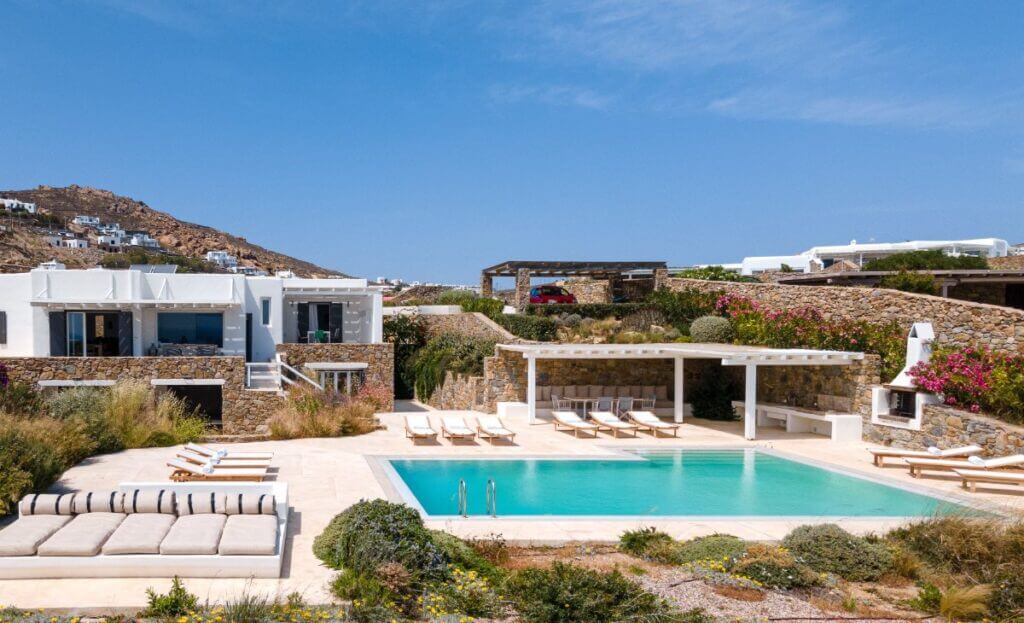 Soak up the sun in Mykonos at a stunning rental villa with a private deluxe pool.