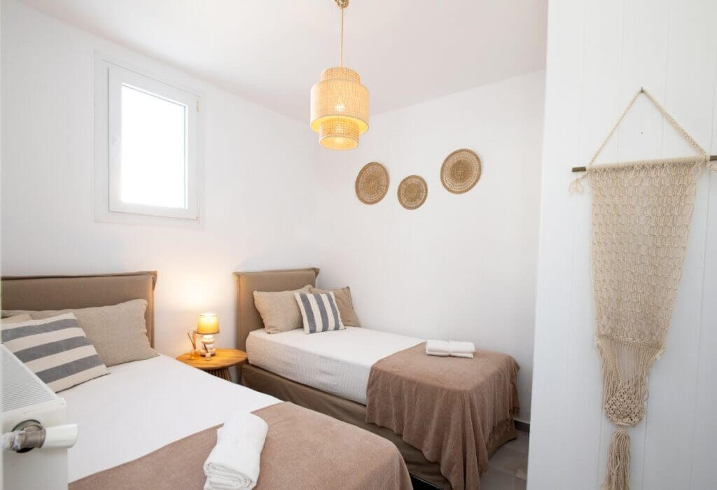Stylish bedroom in Mykonos lavish villa for rent, Greece.