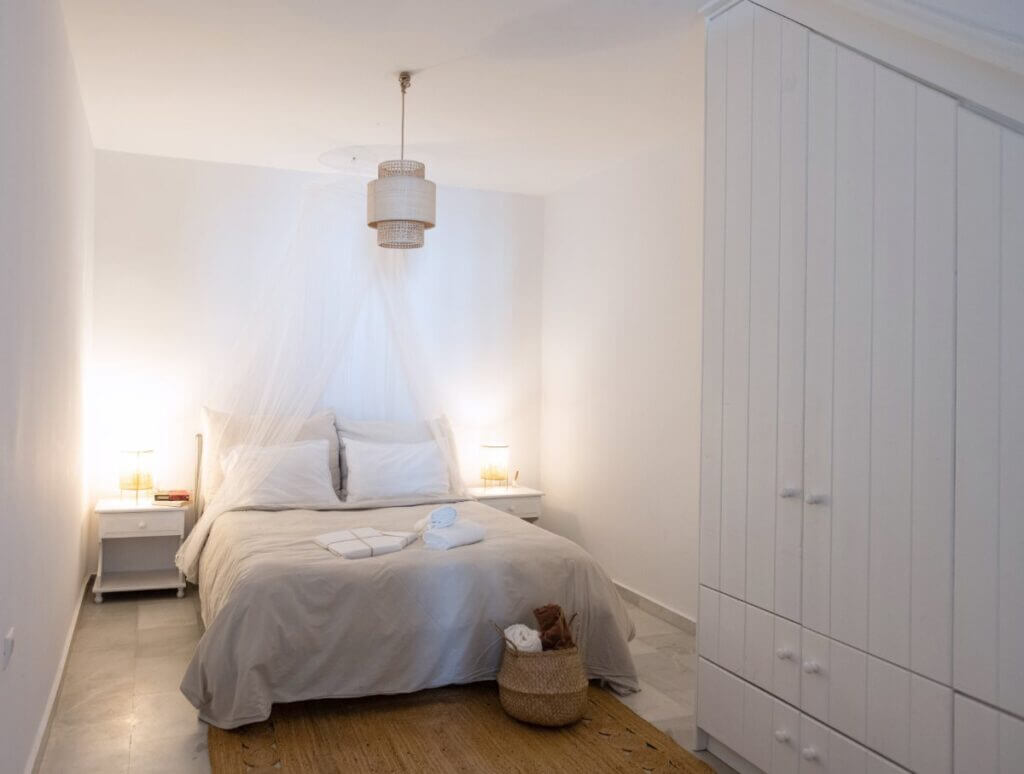 Classic luxurious bedroom in a splendid villa in Mykonos for rent.