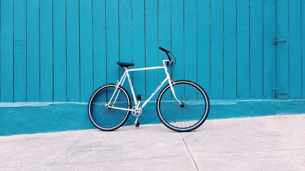 A bike leaning on a wall
