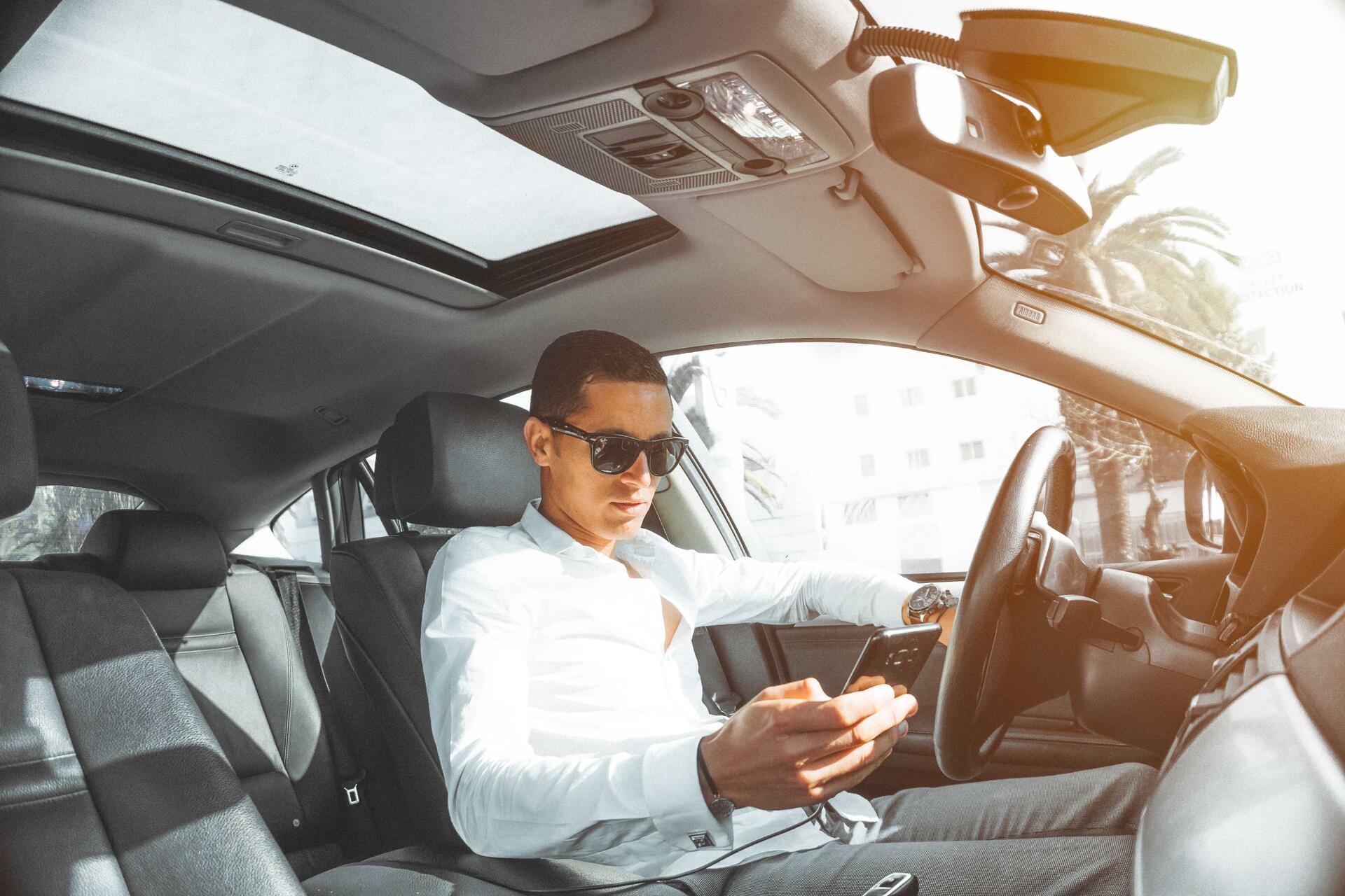 A private driver in his car