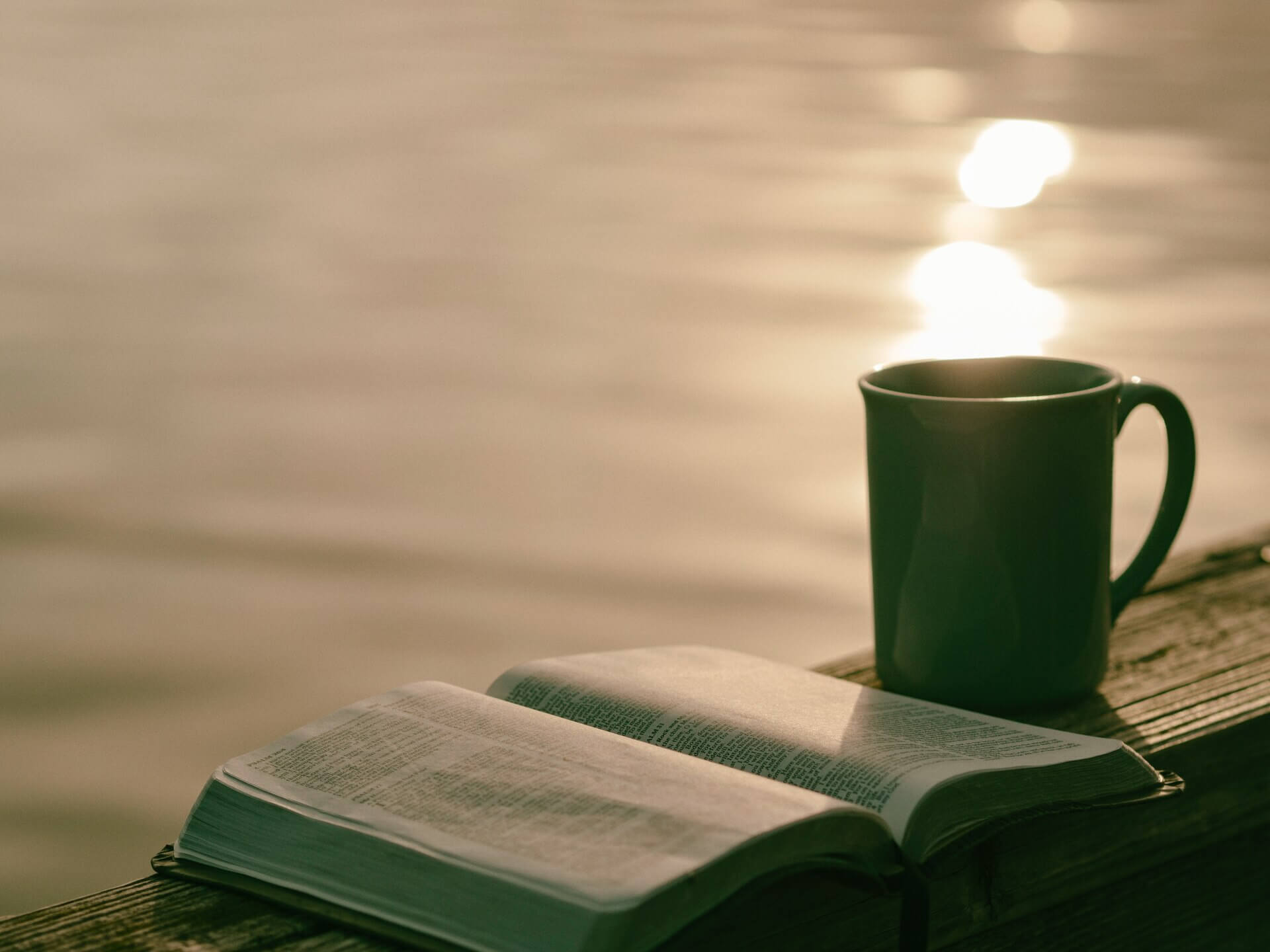 An open book and a cup of coffee