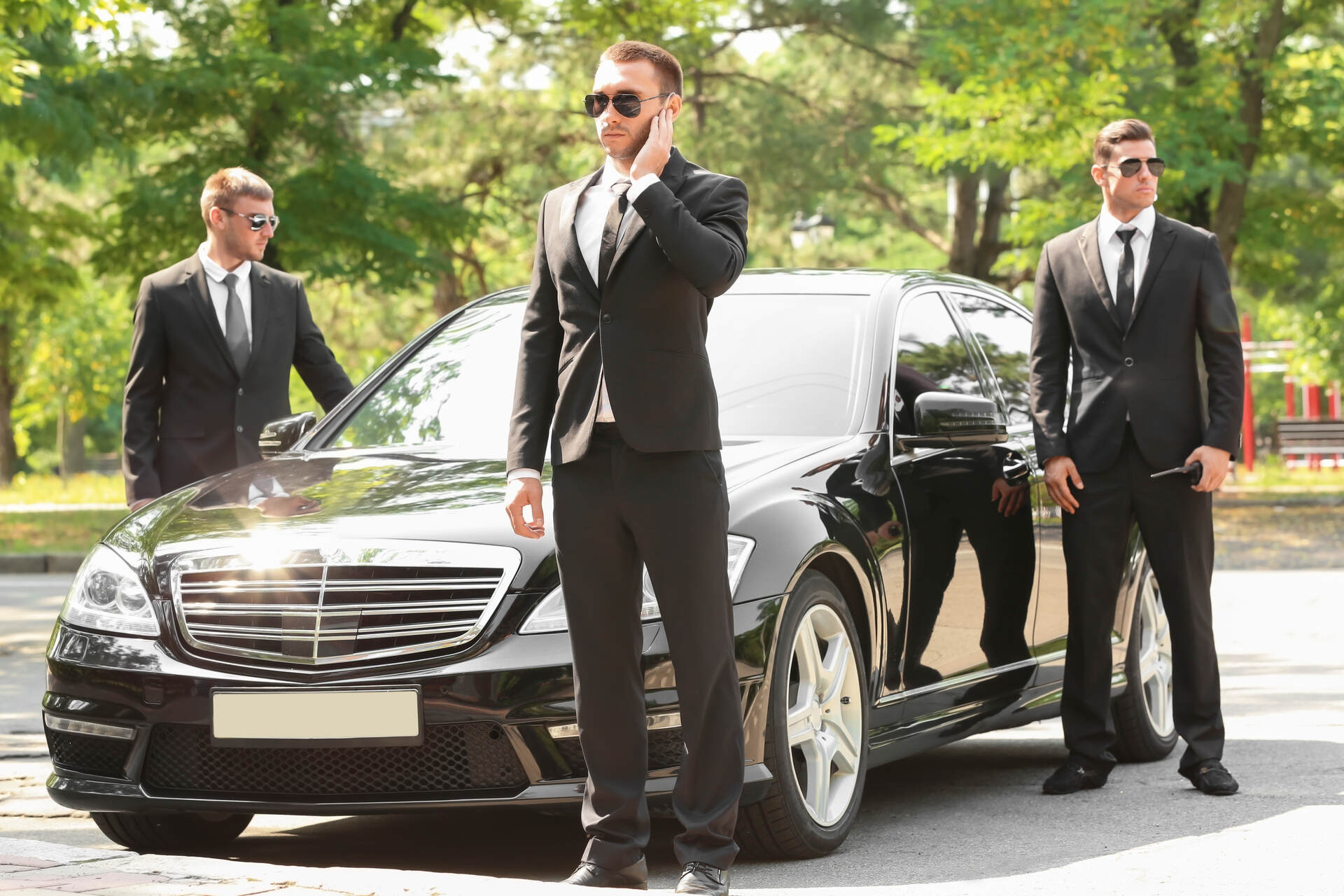Bodyguards in front of the car 