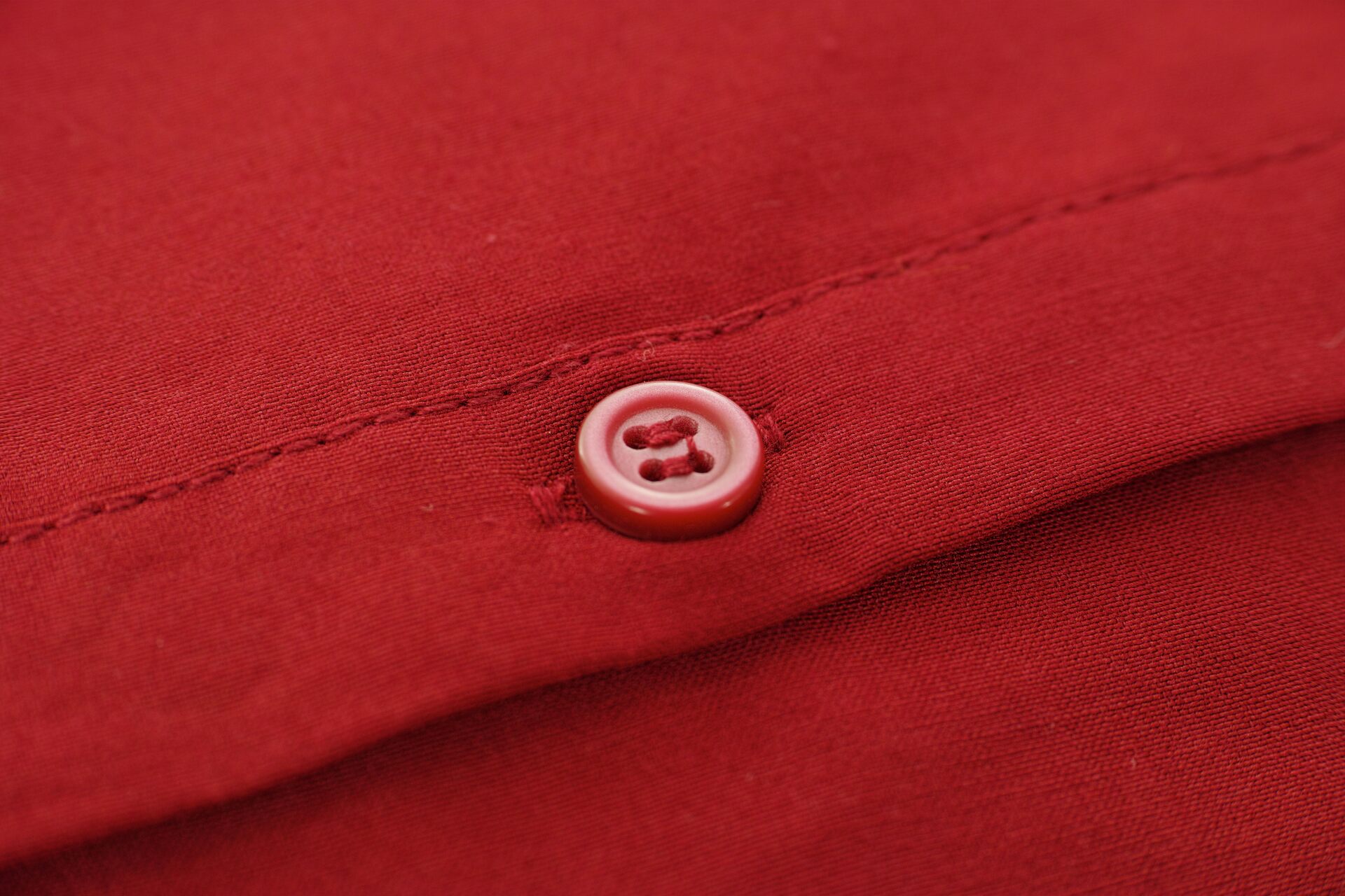 Red button on a red shirt 