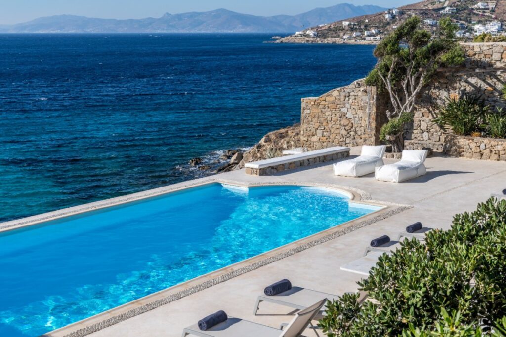 Private pool, the view of the Aegean Sea, and Mykonos villa for rent.