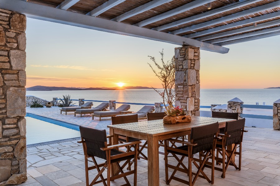 The Aegean Sea, sunset, and beautiful Mykonos villa for rent.
