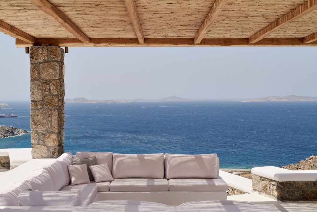 Enjoy the view from the deluxe balcony in the best Mykonos villa for rent.