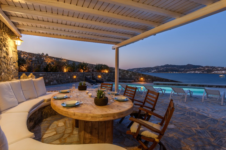 Outdoor area by a luxurious pool in Mykonos best rental villa.