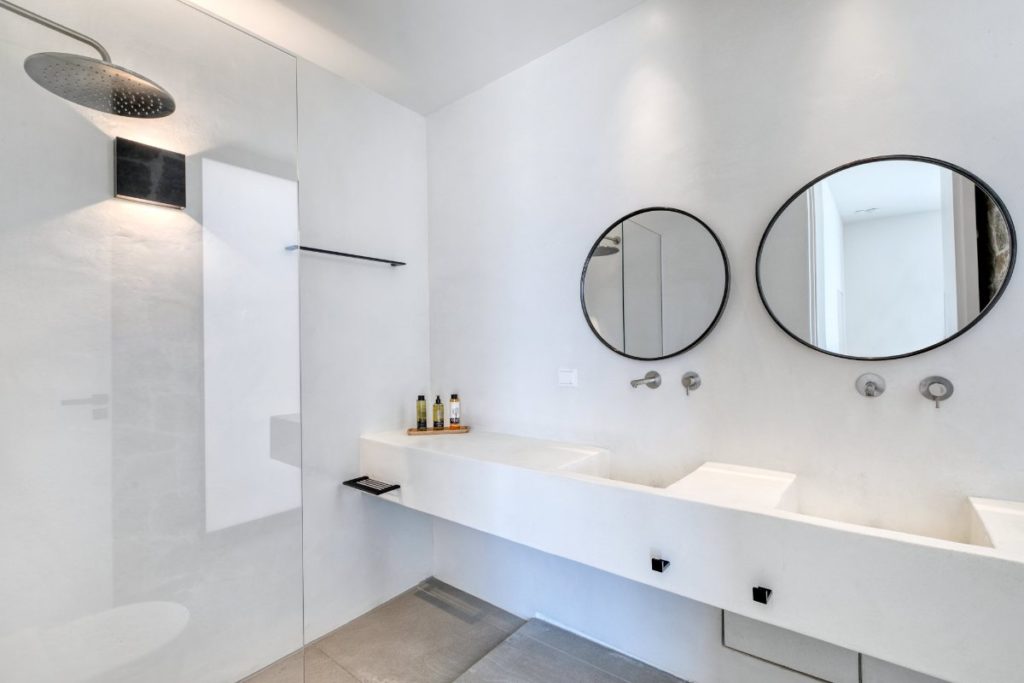 Good quality material sinks, and modern showers in the bright bathroom of Mykonos private rental home.