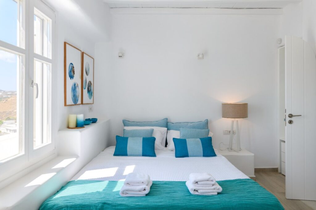 Spacious bedroom in a luxurious Mykonos villa for rent.