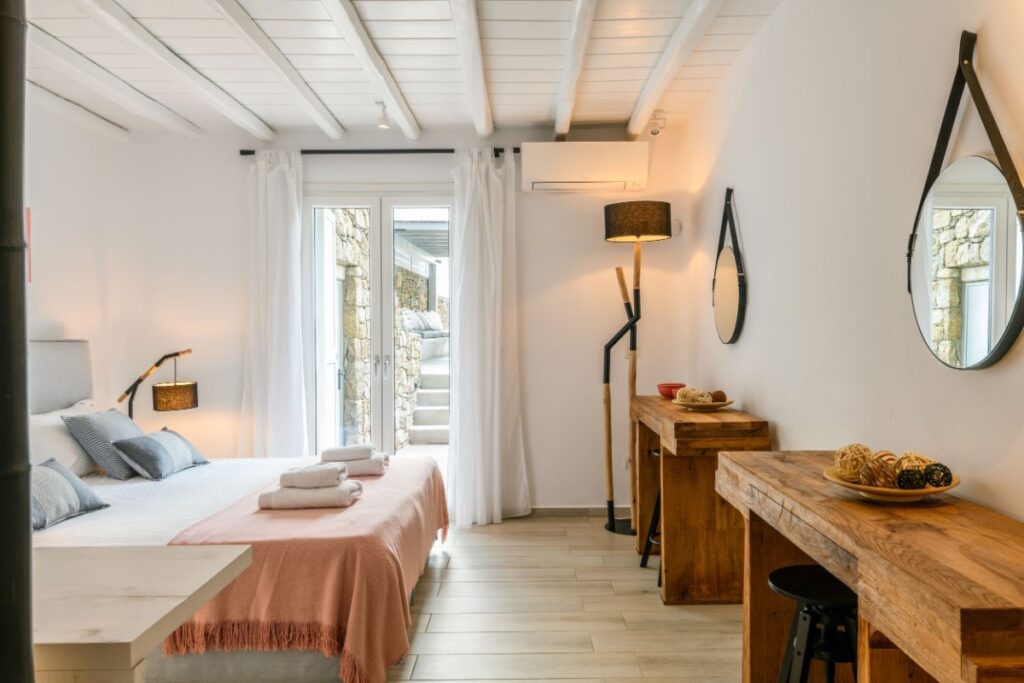 Modern bedroom in a lavish villa in Mykonos, ready for booking.
