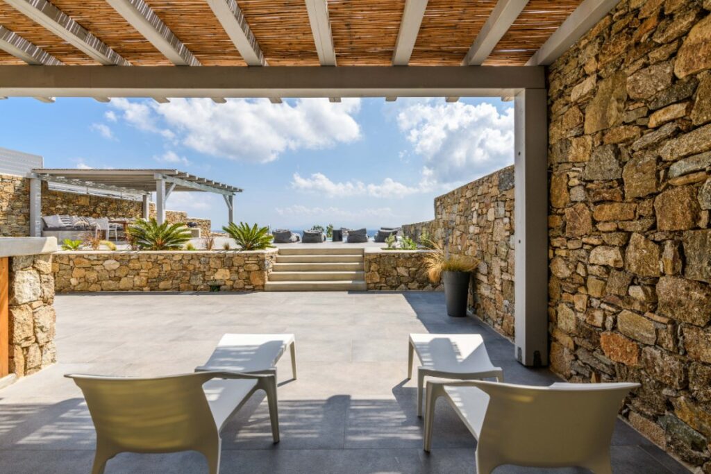 Mykonos villa with a terrace and sea panorama, available for rent.