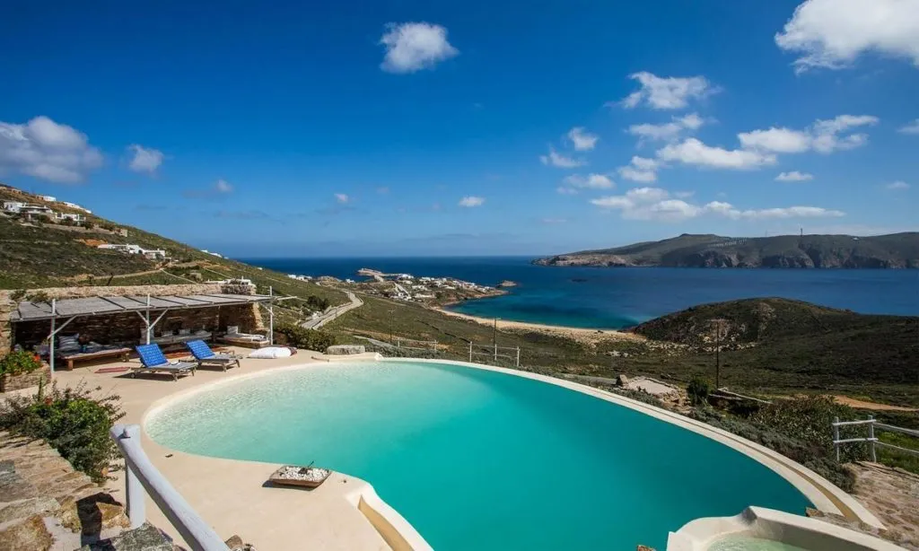 outdoor area with huge pool and climbers for sunbath