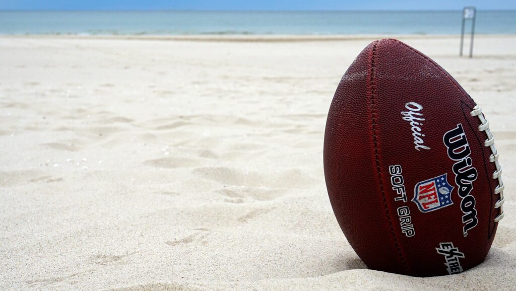 A rugby ball on the beach
