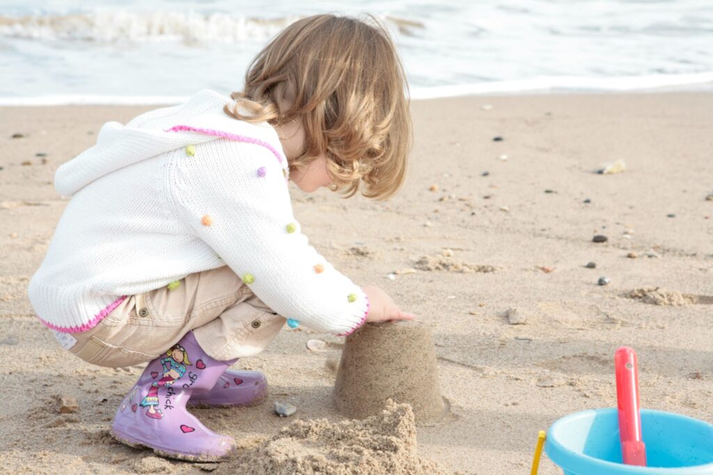 A girl building a sand castle