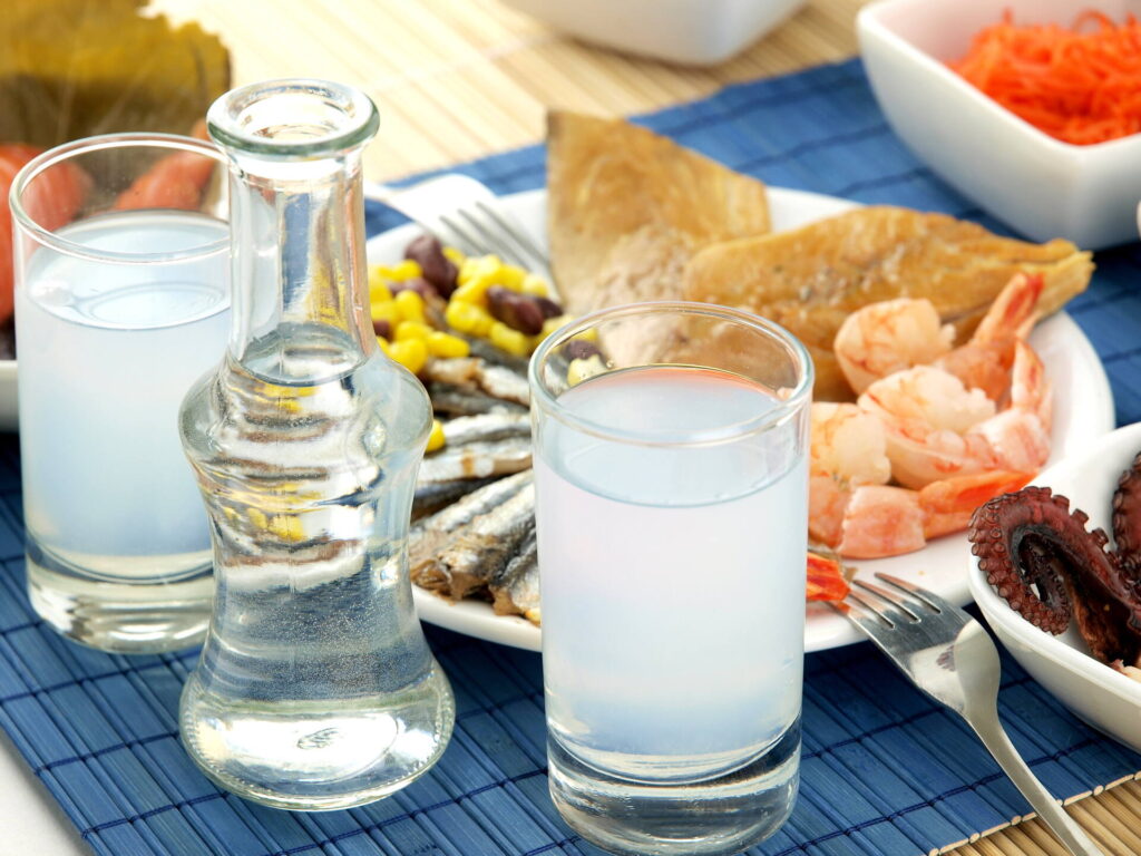 Glasses of ouzo and meze 
