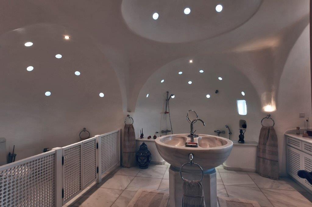 bathroom with small holes through which light penetrates
