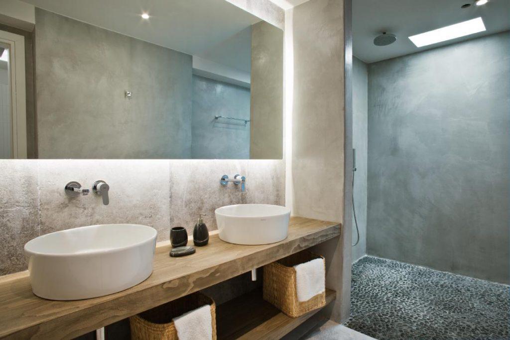 illuminated spacious bathroom with huge glass sower cabin