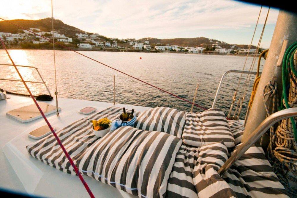 Sailboat with pillows and wine on the deck