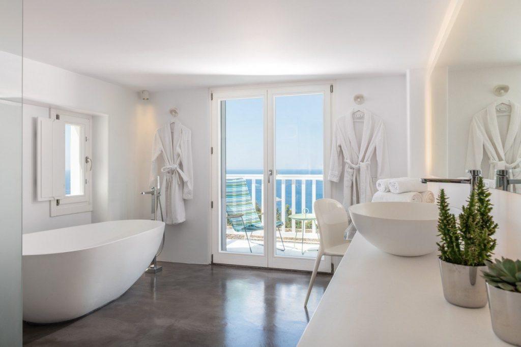 white luxurious bathroom with bathtub and mirror
