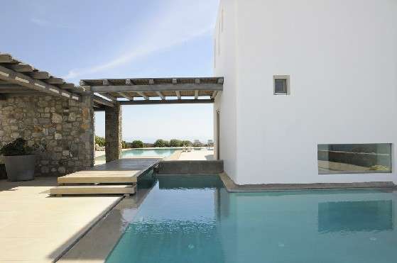 Villa Elizabeth, Aleomandra, Mykonos, exterior, white building, porch, swimming pool, plant pots, nature, blue sky