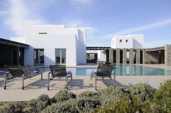 Villa Elizabeth, Aleomandra, Mykonos, exterior, white building, stone walls, porch, swimming pool, sunbeds, pool chairs, nature, bushes, blue sky
