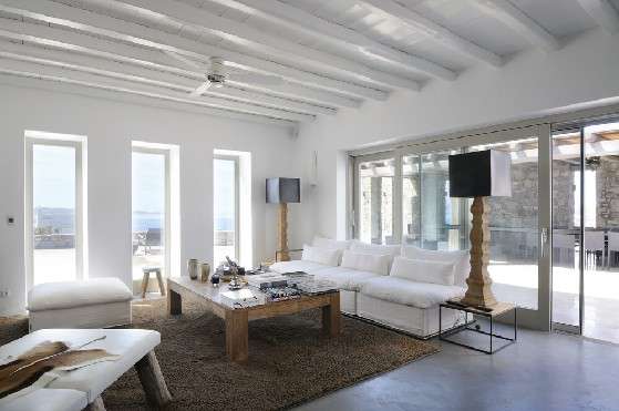 Villa Elizabeth, Aleomandra, Mykonos, white lounge, sofa, pillows, coffee table, decorative lamp, tabouret, sliding doors, wooden ceiling