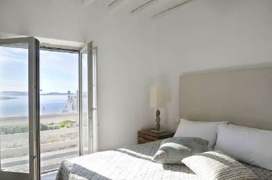 Villa Elizabeth, Aleomandra, Mykonos, bedroom, queen size bed, pillows, night table, night lamp, balcony doors, panoramic sea view