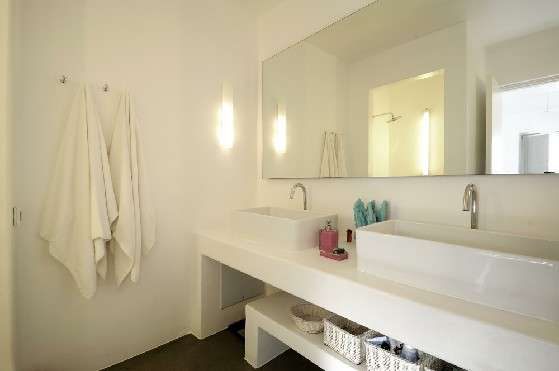 Villa Elizabeth, Aleomandra, Mykonos, bathroom, washbasins, towels, soap dispenser, mirror, cupboards, woven baskets