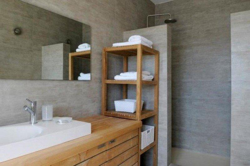 modern designed bathroom with shower and towel shelf