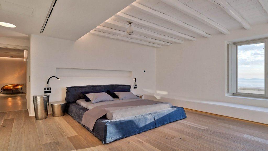 Villa Aphrodite, Agia Sofia, Mykonos, bedroom, queen size bed, night table, night lamp, wooden ceiling